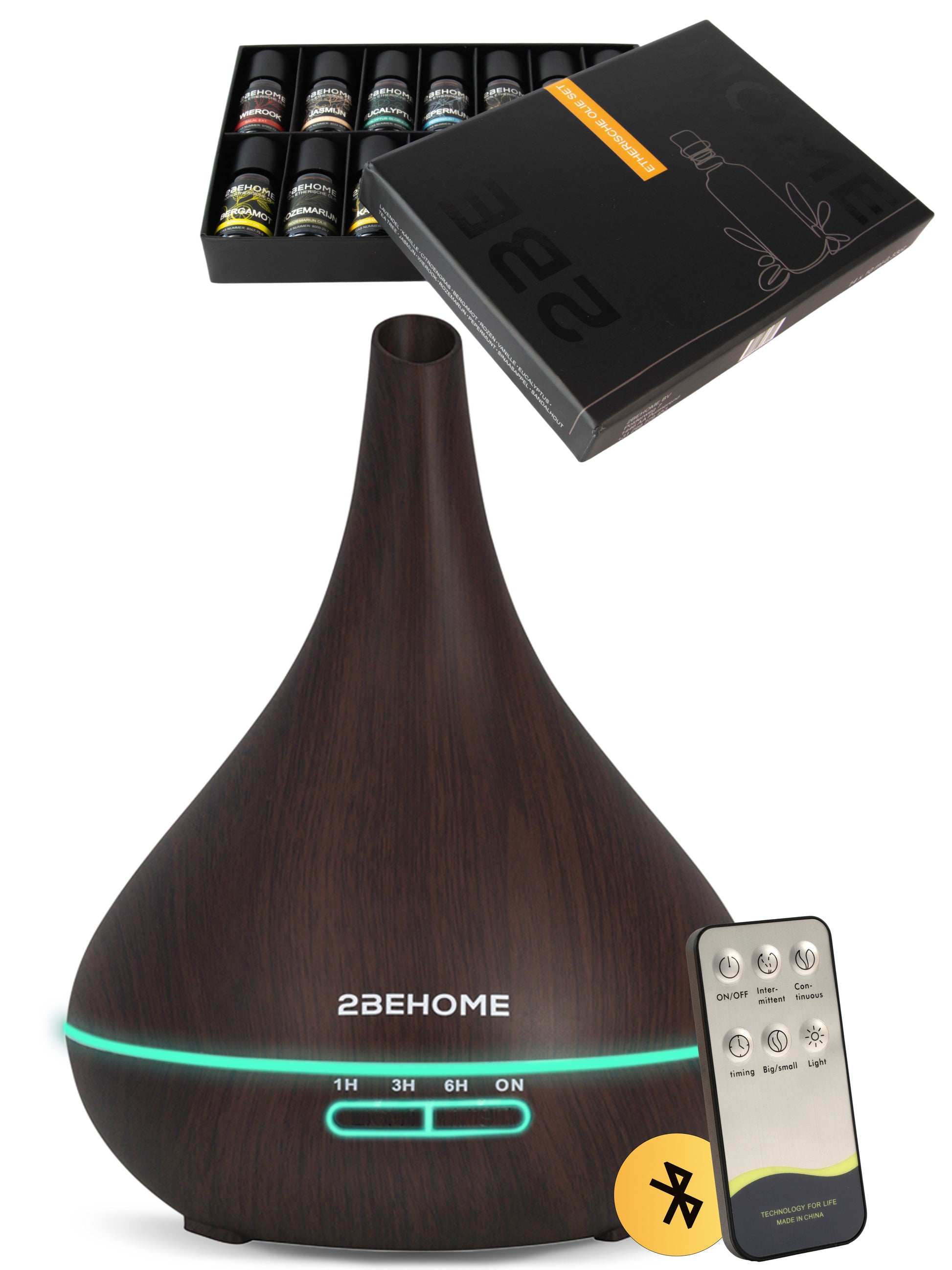 Aroma diffuser luchtbevochtiger met lange nek, en afstandsbediening. Daarboven zie je de meegeleverde etherische olie set.