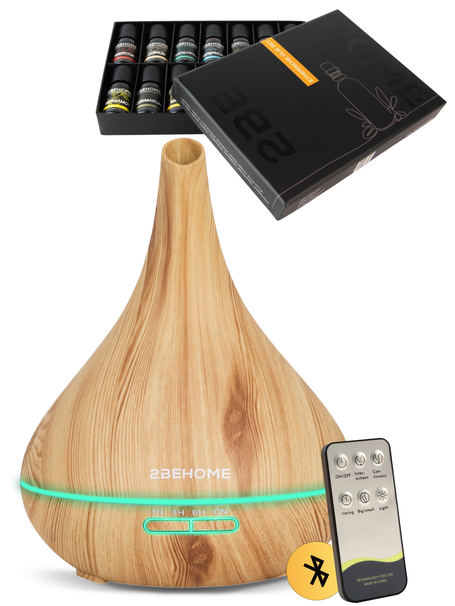 Aroma diffuser luchtbevochtiger met lange nek, en afstandsbediening. Daarboven zie je de meegeleverde etherische olie set.